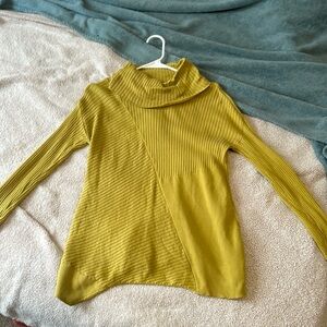 Cowl neck sweater with an asymmetrical hem. Size small.